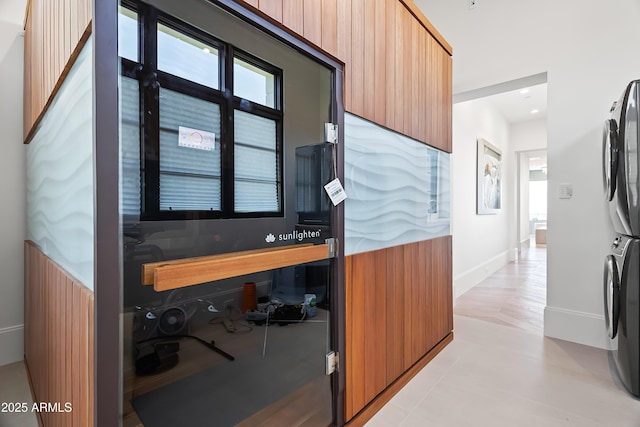 interior space with stacked washer and dryer