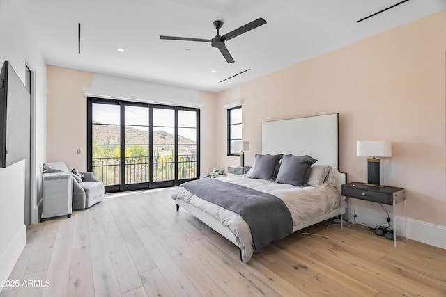 bedroom with ceiling fan, access to exterior, and light hardwood / wood-style flooring