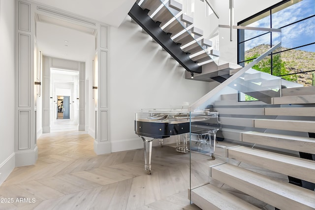 staircase with parquet floors