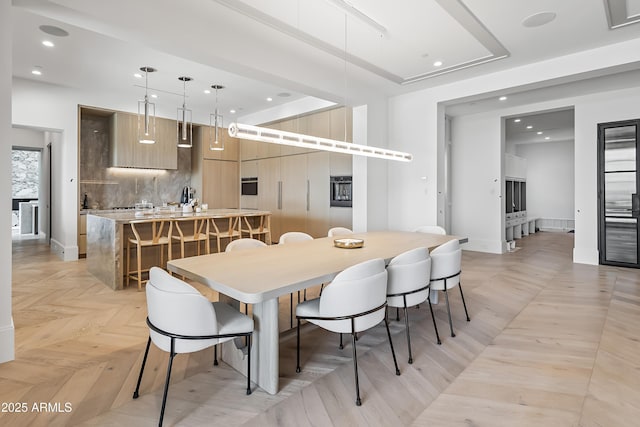 dining area with light parquet flooring