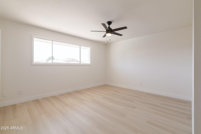 14803 N 55th Ave, Glendale, AZ 85306 - unfurnished room featuring light wood-style floors, baseboards, and a ceiling fan