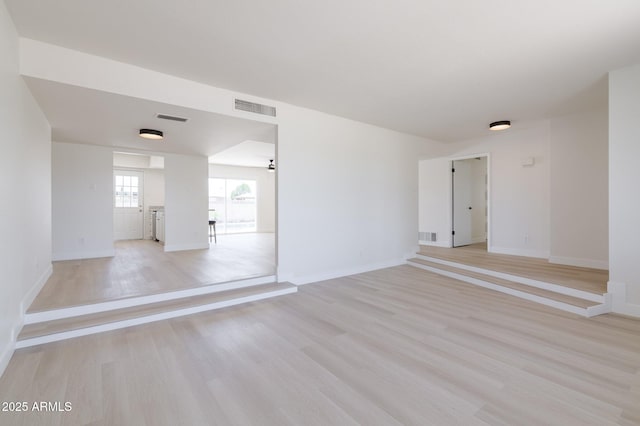 14803 N 55th Ave, Glendale, AZ 85306 - empty room featuring visible vents, baseboards, and light wood-type flooring