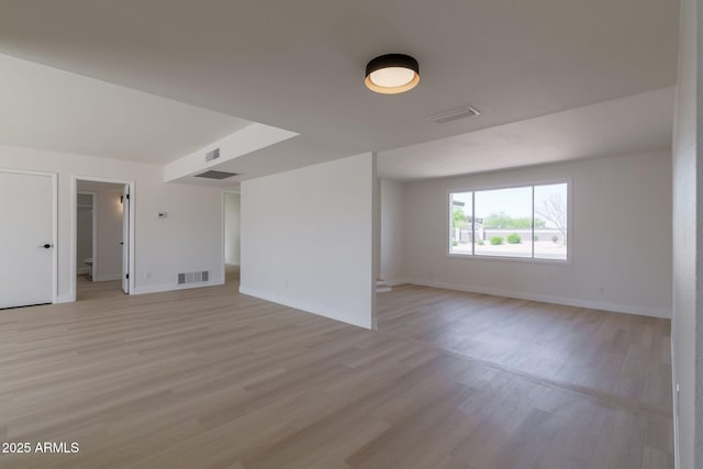14803 N 55th Ave, Glendale, AZ 85306 - empty room featuring light wood-style floors, baseboards, and visible vents