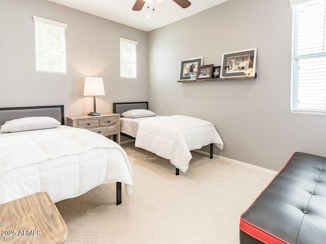 bedroom featuring a ceiling fan, carpet flooring, and baseboards