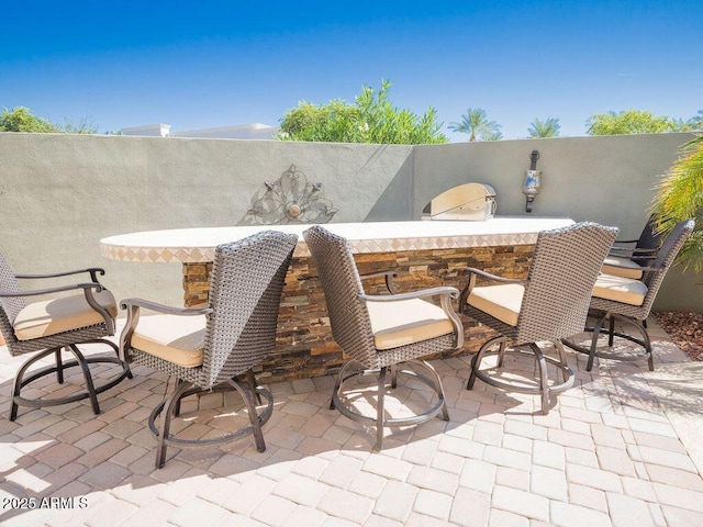 view of patio / terrace featuring outdoor dry bar