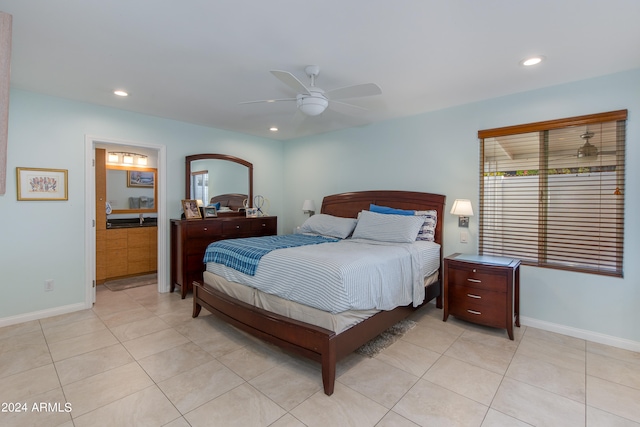 tiled bedroom featuring ceiling fan