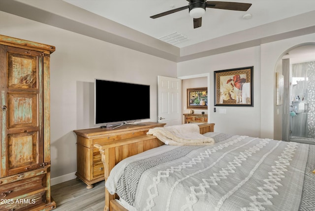 bedroom featuring ceiling fan and light hardwood / wood-style flooring