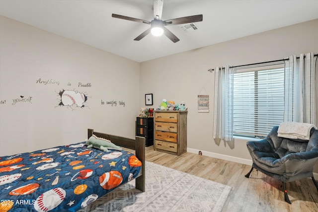 bedroom with ceiling fan and light wood-type flooring