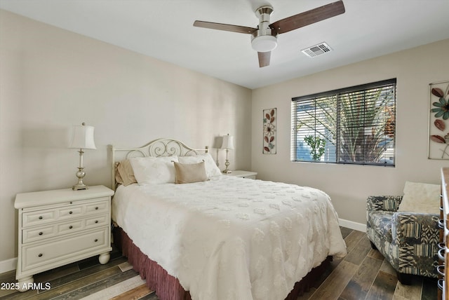 bedroom with dark wood-style floors, baseboards, visible vents, and ceiling fan