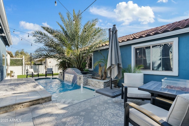 view of swimming pool with a patio and pool water feature