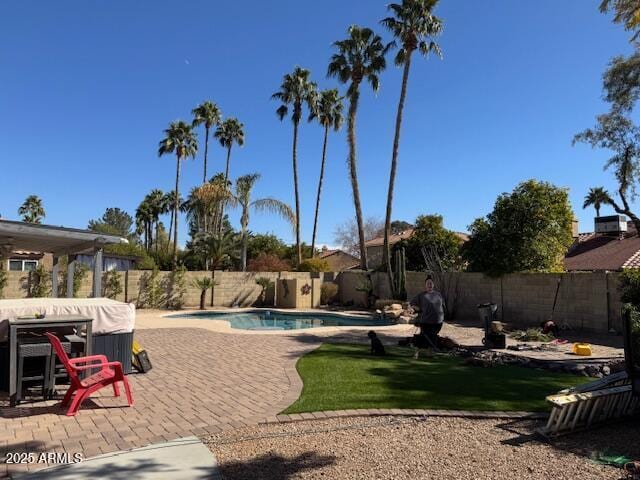 view of pool with a jacuzzi and a patio area