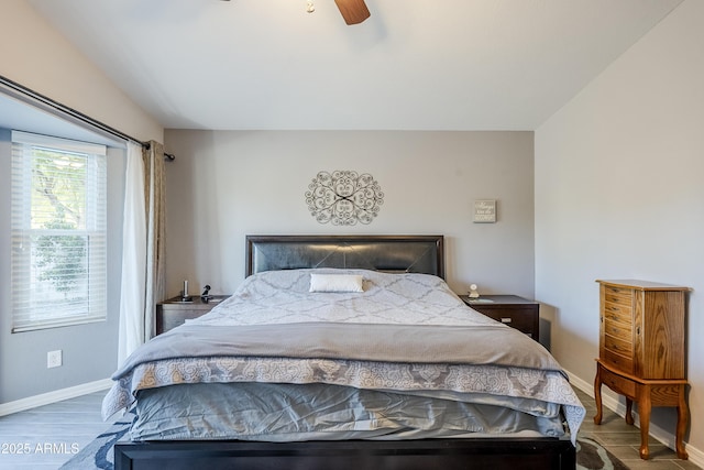 bedroom featuring hardwood / wood-style flooring and ceiling fan