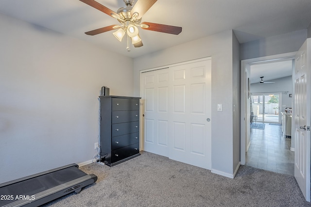 exercise area featuring light carpet