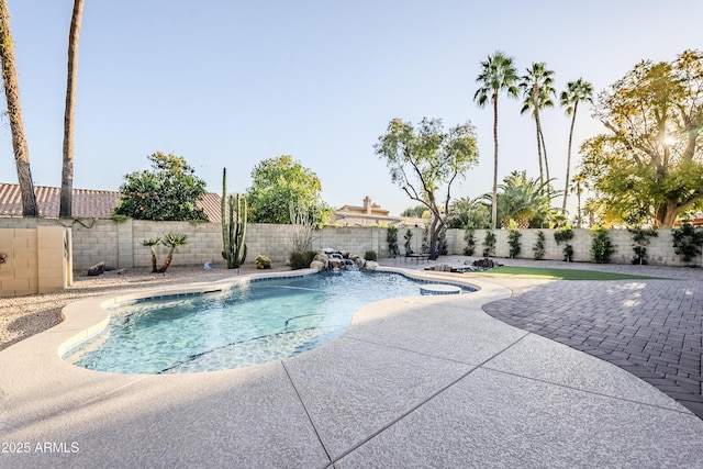 view of swimming pool with a patio area