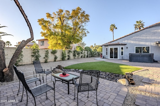 view of patio with a hot tub