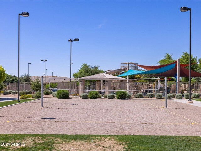 view of home's community featuring volleyball court