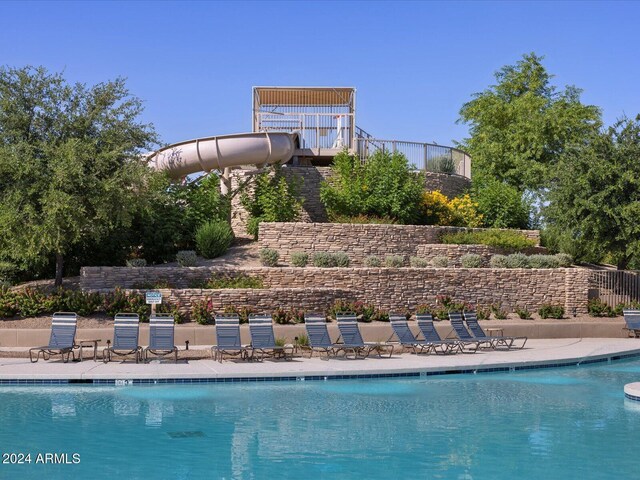 view of swimming pool featuring a water slide