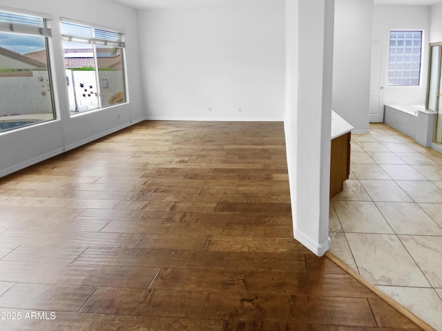 spare room with light wood-style flooring