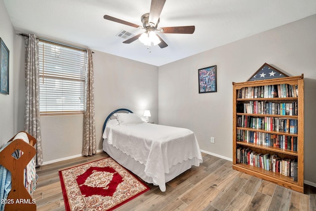 bedroom with hardwood / wood-style flooring and ceiling fan