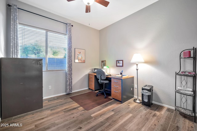 office featuring dark wood-type flooring and ceiling fan