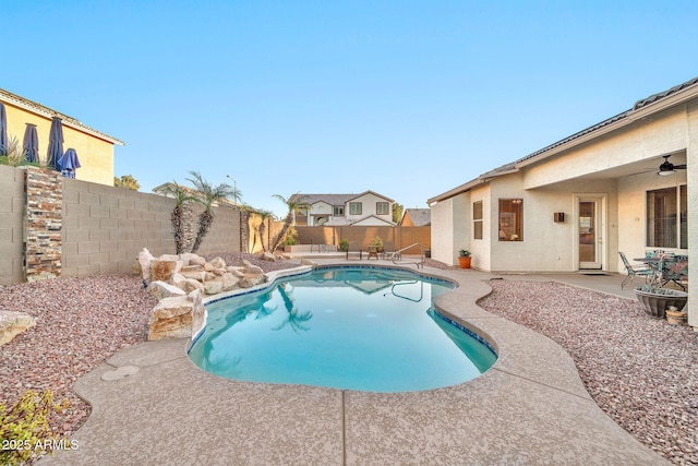 view of pool featuring a patio area and ceiling fan