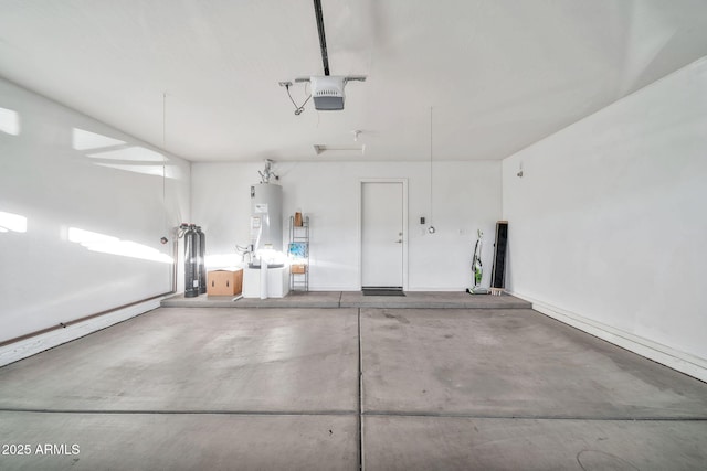 garage featuring a garage door opener and water heater