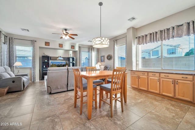 dining area featuring ceiling fan