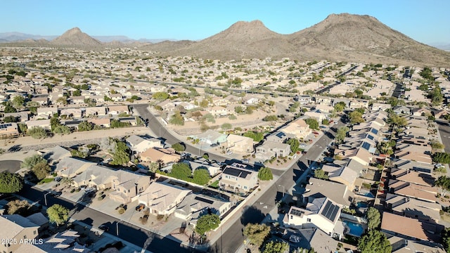 birds eye view of property with a mountain view