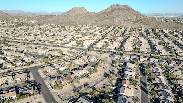 birds eye view of property with a mountain view