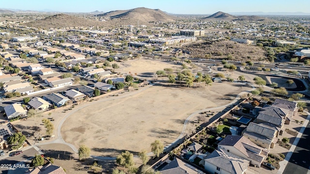 birds eye view of property with a mountain view