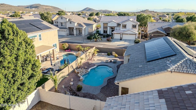 birds eye view of property with a mountain view