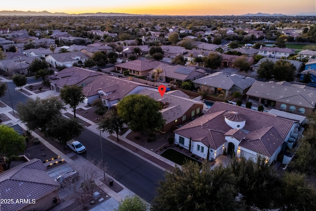 aerial view at dusk with a residential view