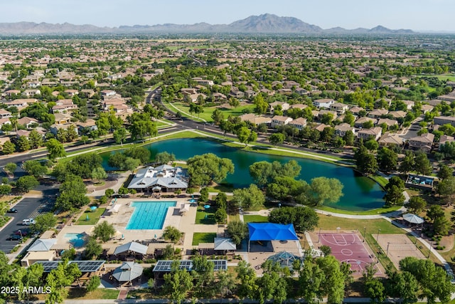 birds eye view of property with a residential view and a water and mountain view