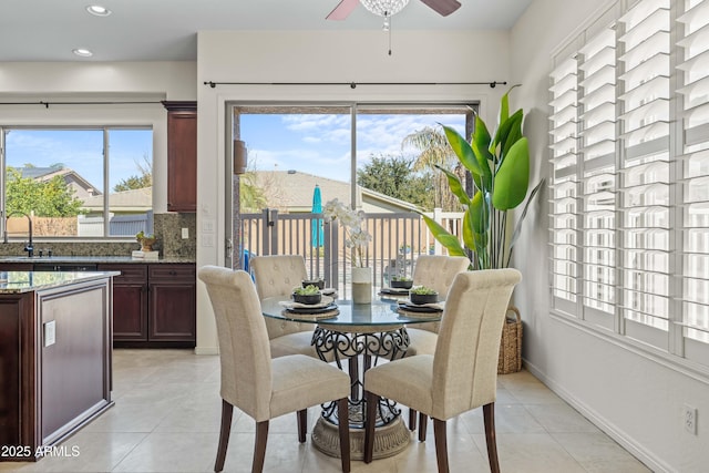 dining room featuring light tile patterned floors, ceiling fan, recessed lighting, and baseboards