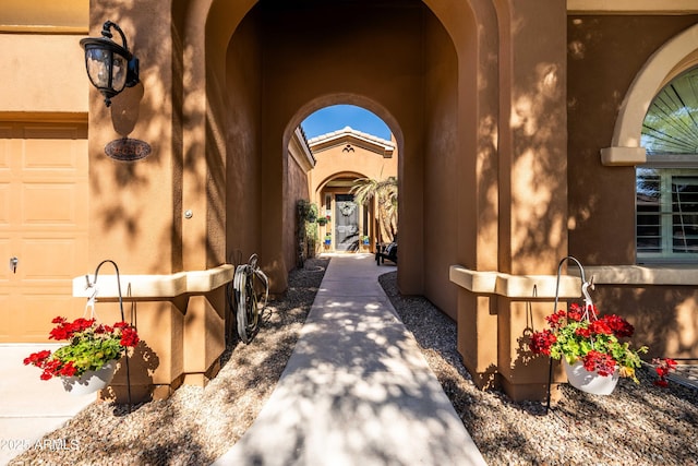 view of exterior entry with a garage