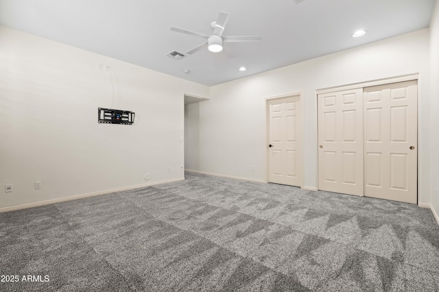 unfurnished bedroom featuring recessed lighting, carpet flooring, visible vents, and baseboards