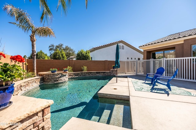 view of pool featuring a patio area, a fenced backyard, and a fenced in pool