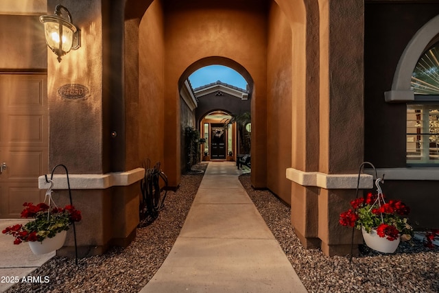 property entrance featuring an attached garage