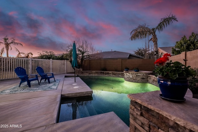 view of pool featuring a patio area, a fenced backyard, and a fenced in pool