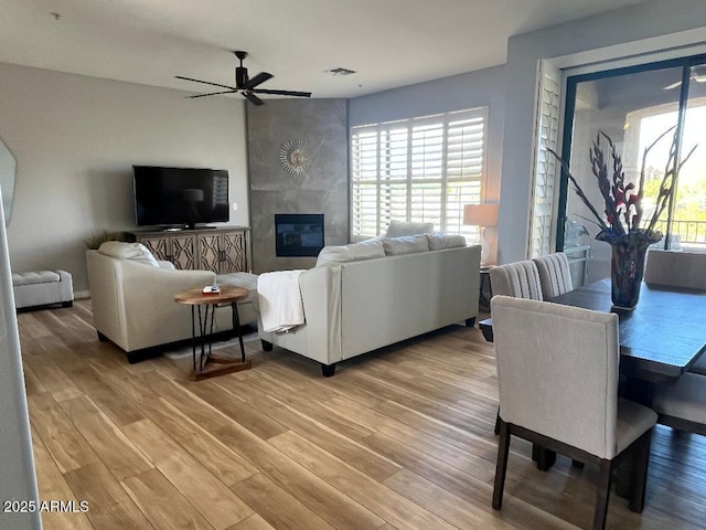 living room with plenty of natural light and light wood-style flooring