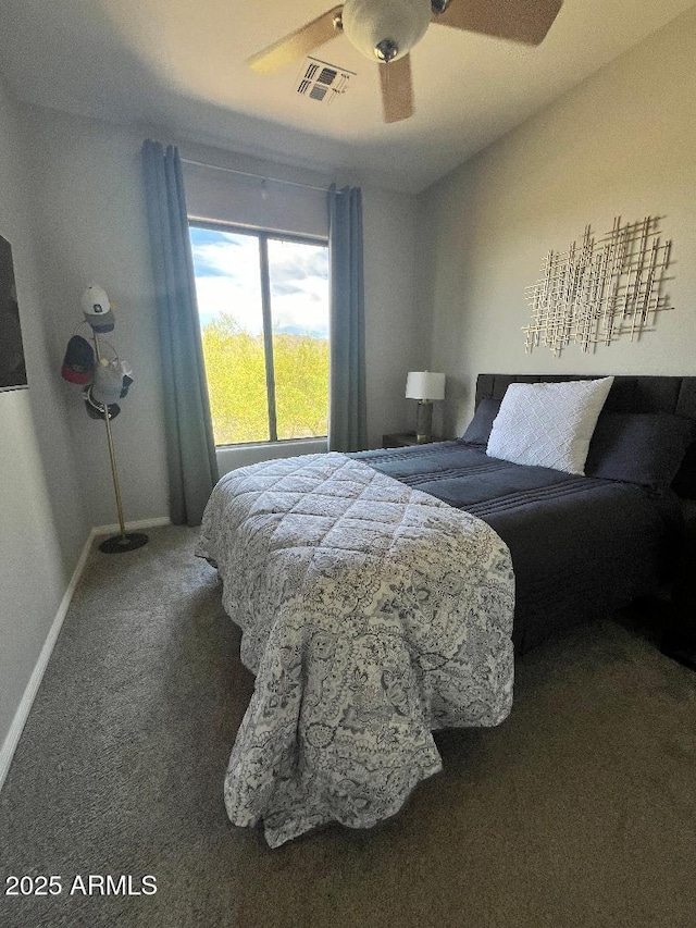 carpeted bedroom featuring a ceiling fan, baseboards, and visible vents