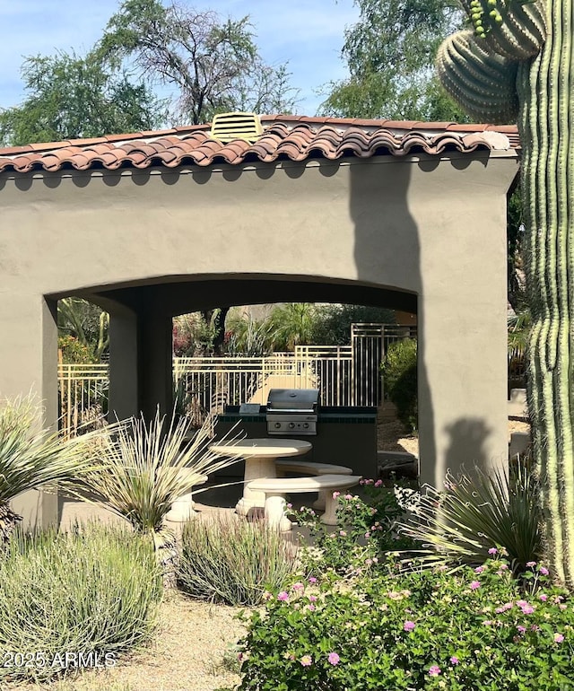 view of patio with fence and grilling area