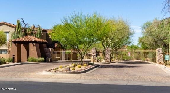 19550 N Grayhawk Dr Unit 2023, Scottsdale, AZ 85255 - view of road with a gate, a gated entry, and curbs