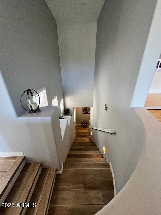 stairs with wood finished floors