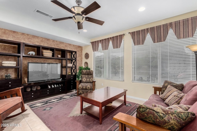 tiled living area with recessed lighting, visible vents, ceiling fan, and baseboards