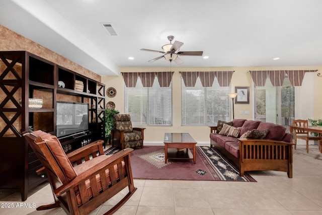 tiled living area featuring a ceiling fan, recessed lighting, and visible vents