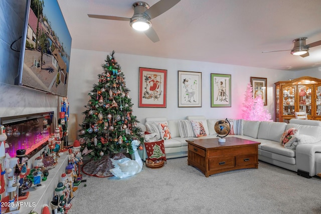 living room with ceiling fan and light colored carpet