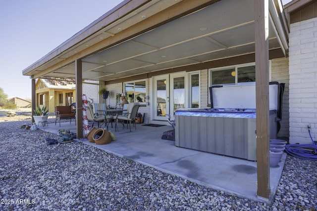 view of patio / terrace featuring a hot tub