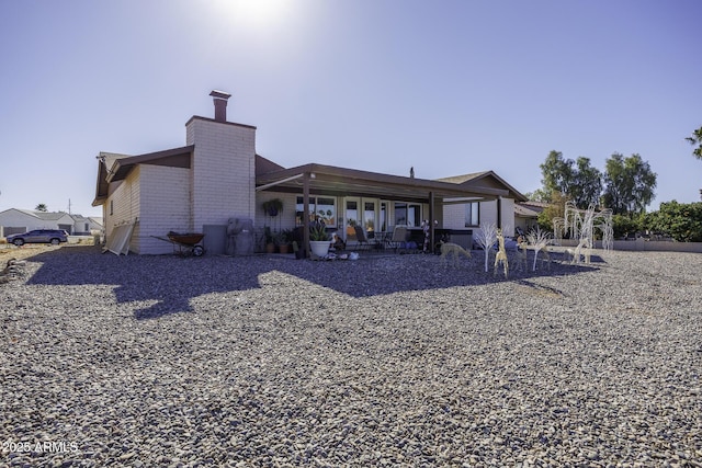 back of house with a patio area