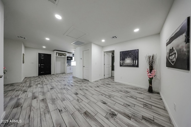 unfurnished living room with light hardwood / wood-style flooring